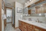 Master bathroom with dual sink vanity and separate shower and tub